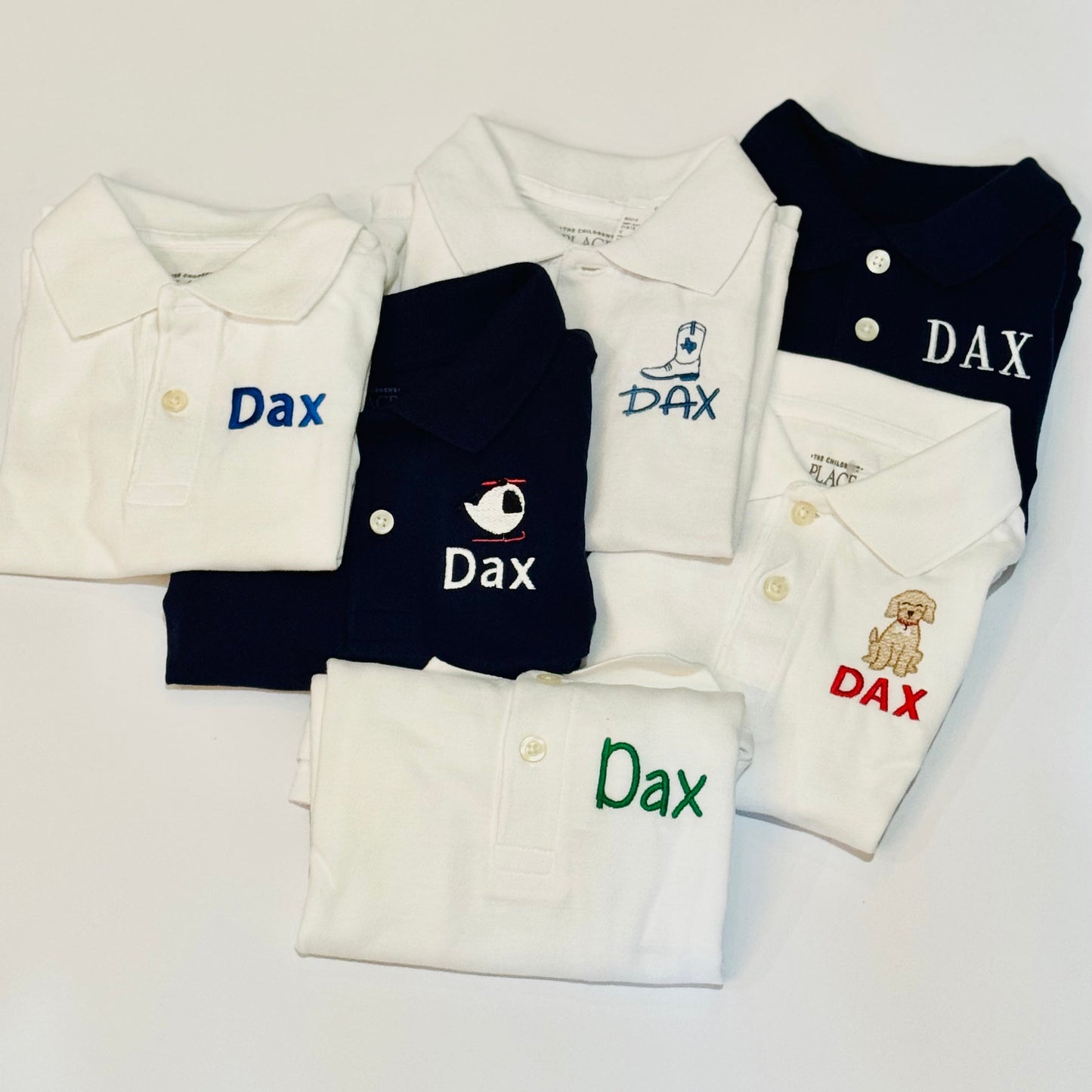 Folded clothing items with 'Dax' branding on a white background